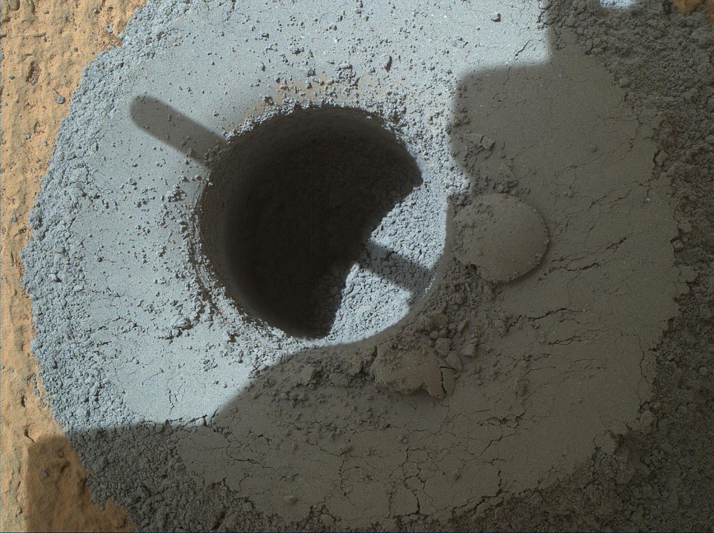 This hole, with a diameter slightly smaller than a U.S. dime coin, was drilled by NASA's Curiosity Mars rover into a rock target called "Telegraph Peak," within the basal layer of Mount Sharp. Image: NASA/JPL-Caltech/MSSS.