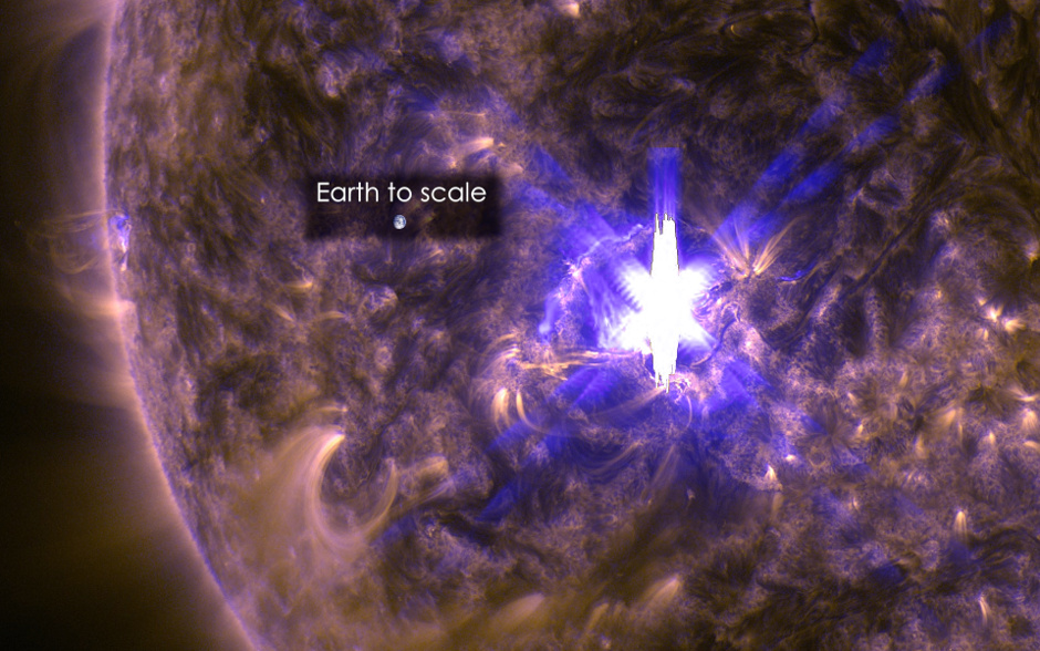 NASA's Solar Dynamics Observatory captured an image of a mid-level solar flare on March 11th, 2015, seen as a bright flash of light on the left side of the sun. Earth is shown for scale. Image credit: NASA/SDO