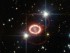 The still unravelling remains of supernova 1987A are shown in this image taken by NASA's Hubble Space Telescope. The bright ring consists of material ejected from the dying star before it detonated. The ring is being lit up by the explosion's shock wave. Image credit: ESA/Hubble & NASA.