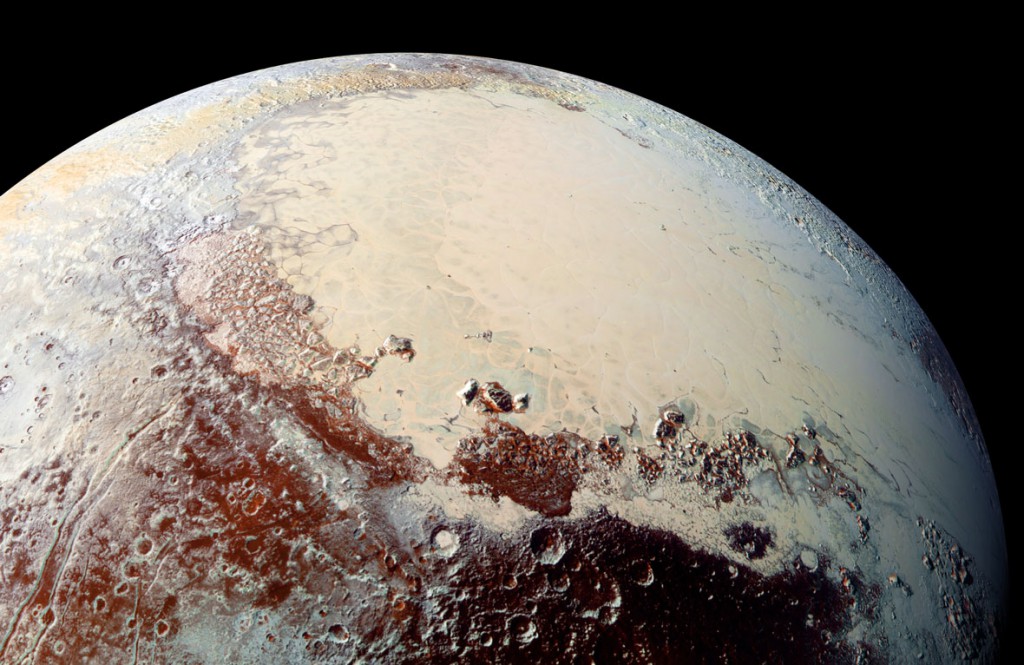  Looking across Pluto’s Sputnik Planum and the mountains and craters that surround it. Image: NASA/JHUAPL/SwRI.