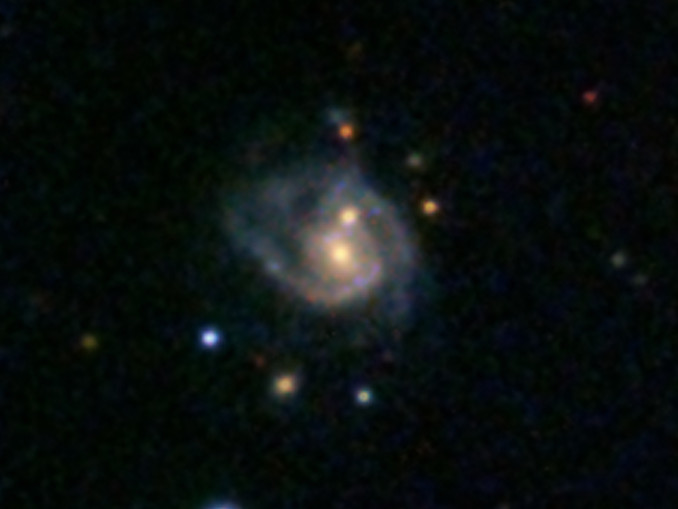 This super spiral, catalogued as 2MASX J08542169+0449308, contains two galactic nuclei, instead of just the usual one, and thus looks like two eggs frying in a pan. Image credit: SDSS.