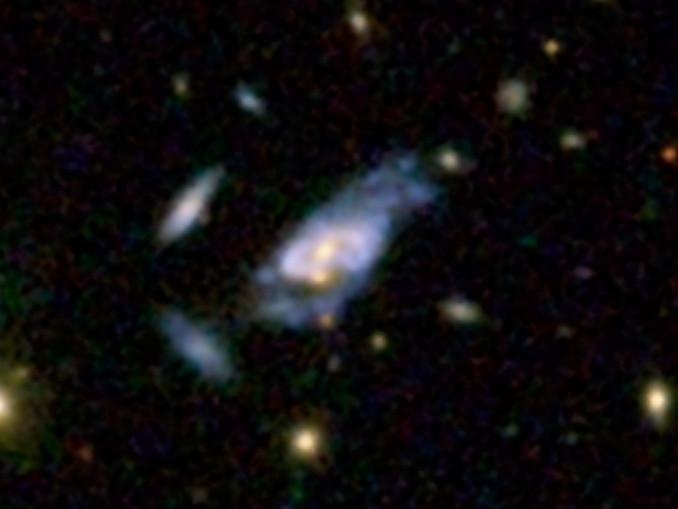 This image shows a super spiral designated 2MASX J16014061+2718161, and it also contains the double nuclei. Image credit: SDSS.