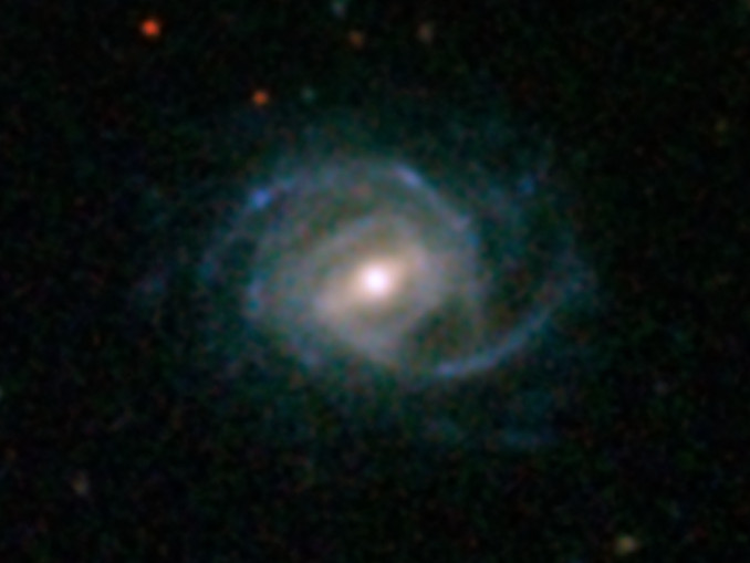 A huge galaxy with the moniker SDSS J094700.08+254045.7 stands as one of the biggest and brightest super spirals. The mega-galaxy's starry diss and spiral arms stretch about 320,000 light-years across, or more than three times the breadth of the Milky Way. Image credit: SDSS.