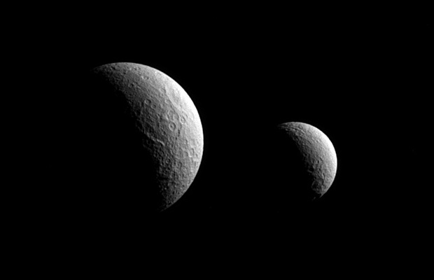 Saturn's moons Tethys and Rhea (left and right, respectively). Image credit: NASA/JPL-Caltech/Space Science Institute.