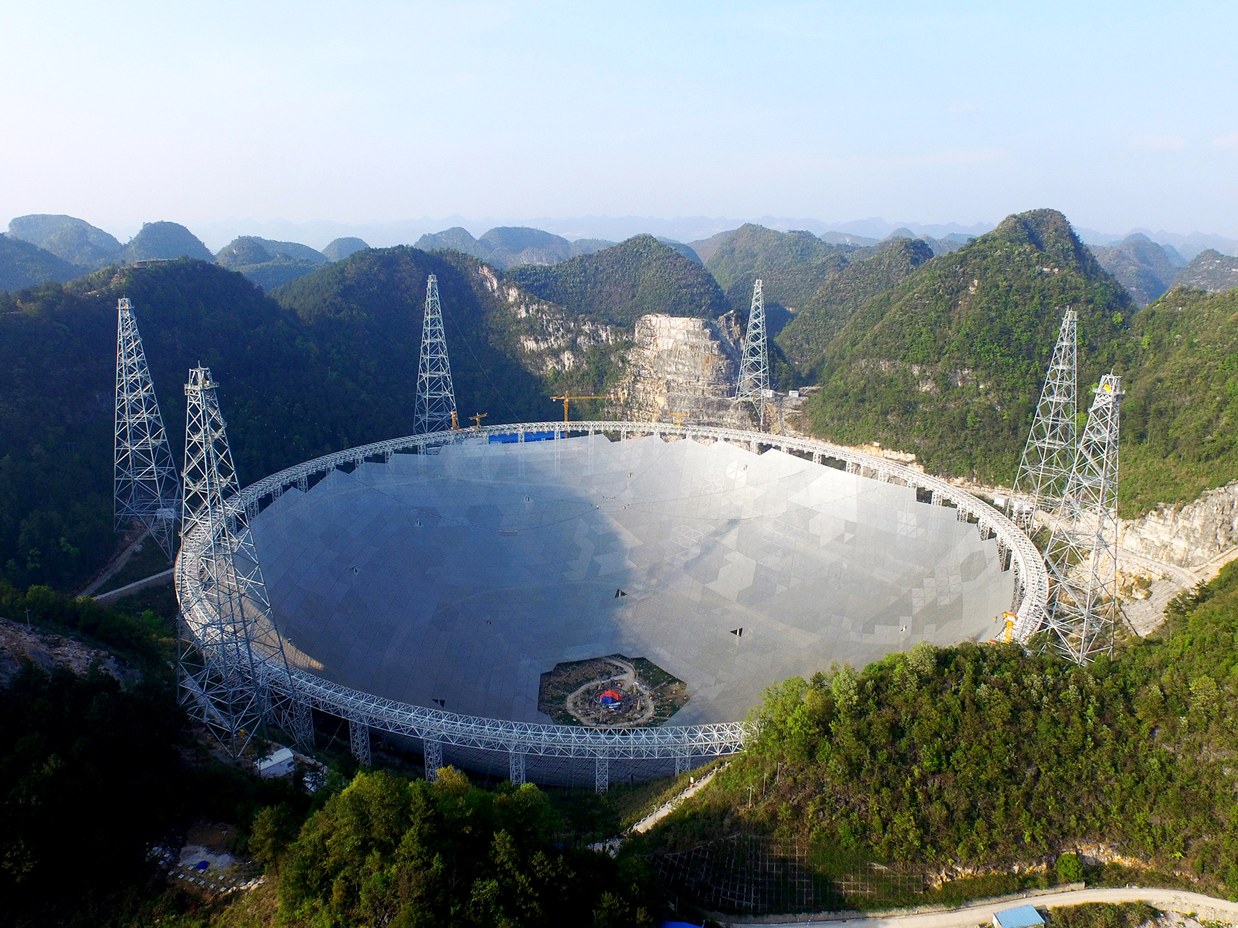 The Five hundred metre Aperture Spherical Telescope (FAST) is a radio telescope under construction in a natural basin in Pingtang County, Guizhou Province, southwest China. Construction on the FAST project began in 2011 and is scheduled for completion by September 2016. Image credit: © NAOC.