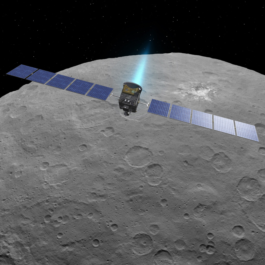 This artist concept shows NASA's Dawn spacecraft above dwarf planet Ceres, as seen in images from the mission. NASA/JPL-Caltech.